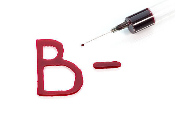 B- blood group written with blood isolated on white